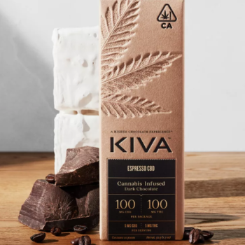 "Kiva Espresso Dark Chocolate CBD 1:1 Bar surrounded by cocoa beans and espresso."